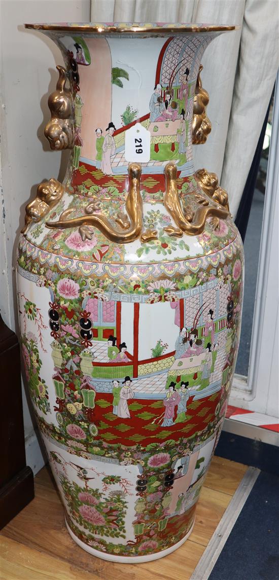 A Canton famille rose large floor vase decorated with panels of figures and flowers height 94cm